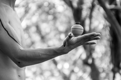 View of spinning top on palm