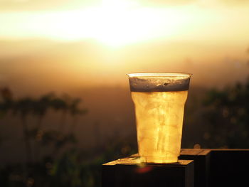 Close-up of beer glass on table