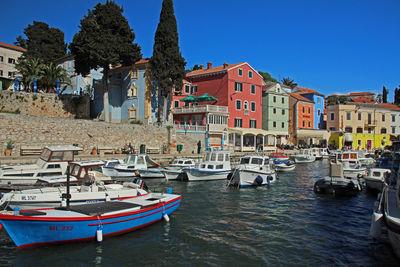 Boats moored at harbor