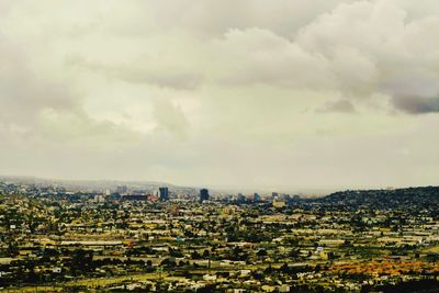 Aerial view of cityscape against sky