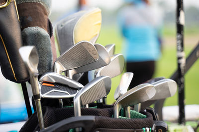 Golfers are about to play golf on bright green grass.