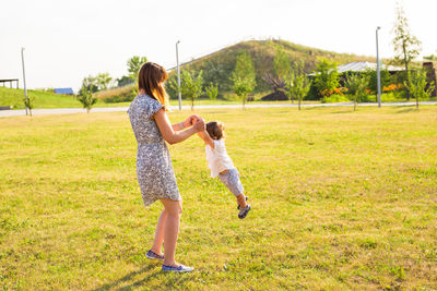 Full length of woman on grassy field