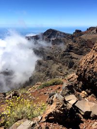 Scenic view of volcanic mountain against sky