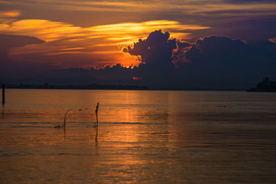 Scenic view of sea against orange sky