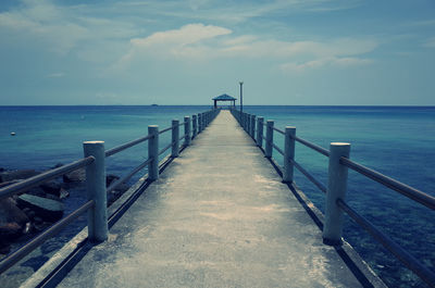 Pier on sea against sky