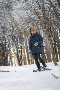 Woman standing in snow