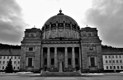 Low angle view of historic building against cloudy sky