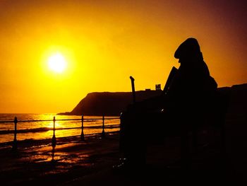 Scenic view of sea at sunset