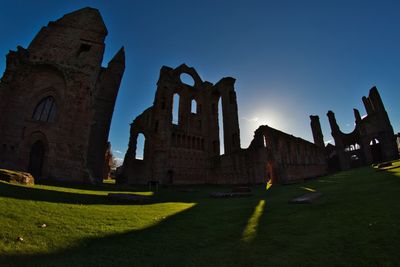 Low angle view of old building against clear sky