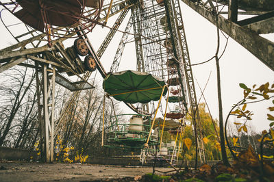 Low angle view of ferris wheel against sky