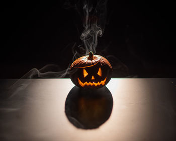 Close-up of illuminated pumpkin at home