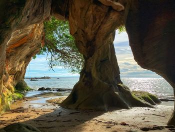 Scenic view of sea seen through rock formation