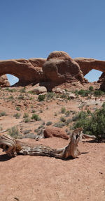 Rock formation on land against clear sky