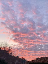 Low angle view of dramatic sky during sunset