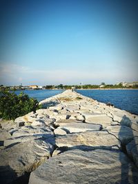 Scenic view of lake against clear blue sky