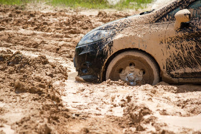 Abandoned car in mud