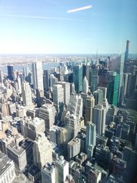 High angle view of modern buildings in city against sky