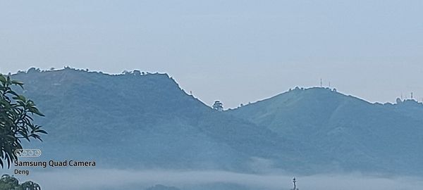 Scenic view of snowcapped mountains against clear sky