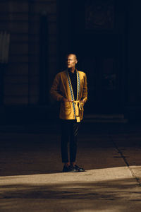 Portrait of young man standing on street