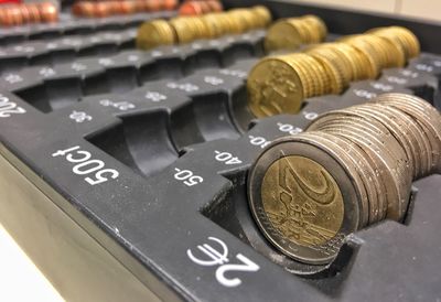 Close-up of coins in container