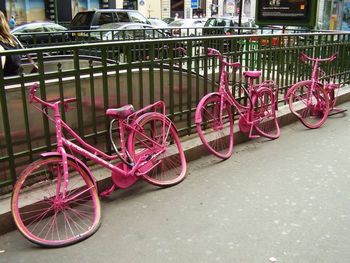 Bicycle parked by metal structure
