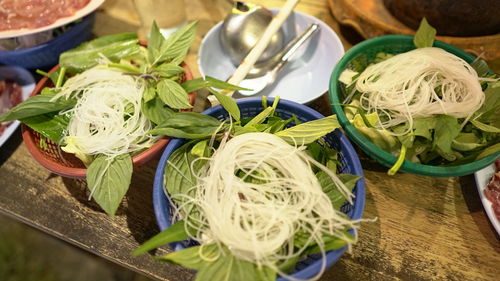 High angle view of chopped vegetables in bowl on table