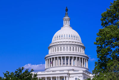 Low angle view of building against blue sky