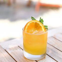 Close-up of orange juice on table