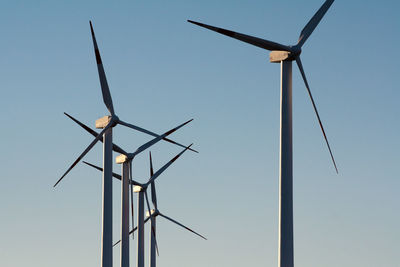 Low angle view of windmill against clear sky