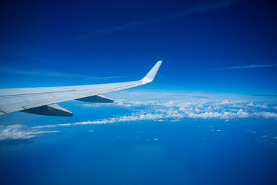 Airplane flying over blue sky