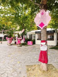 Pink umbrella against trees