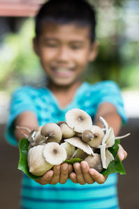 Portrait of smiling girl holding food