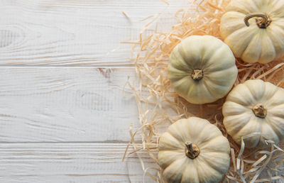 Thanksgiving or harvest flatlay with pumpkins on white wooden background. autumn fall concept. 