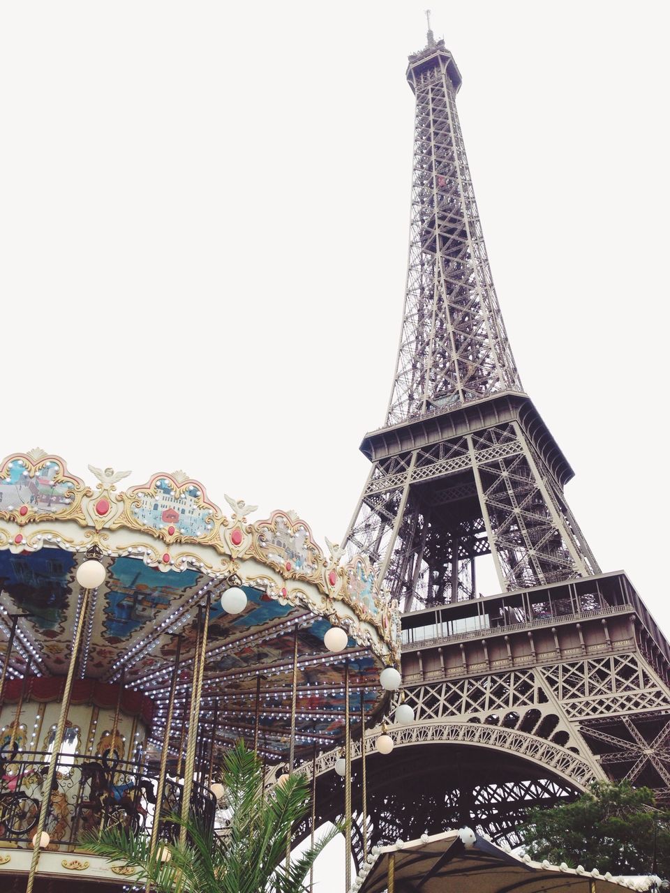 eiffel tower, famous place, international landmark, architecture, low angle view, built structure, clear sky, travel destinations, tourism, culture, capital cities, tower, tall - high, travel, history, metal, architectural feature, building exterior, day, copy space