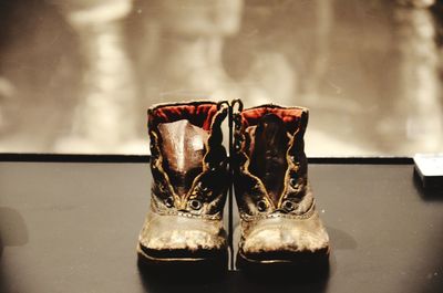 Close-up of shoes on table