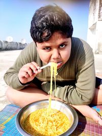 Portrait of man sitting on table