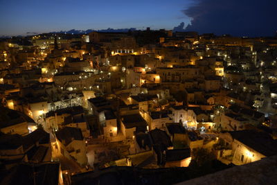 High angle view of illuminated townscape against sky at night