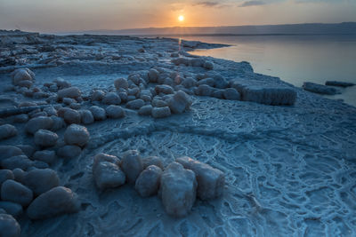Sunset at the lowest point in the earth in the dead sea , where located in south of jordan