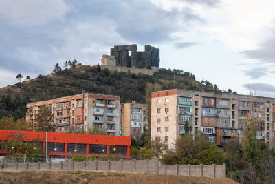 Buildings in city against sky