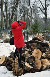 Rear view of woman holding umbrella