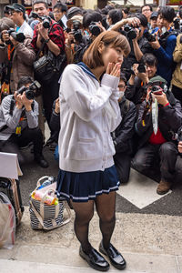 High angle view of people photographing on street