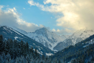 Scenic view of mountains against sky during winter