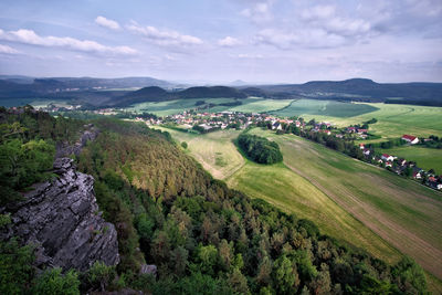 Scenic view of agricultural field against sky