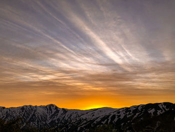 Scenic view of mountains against sky during sunset