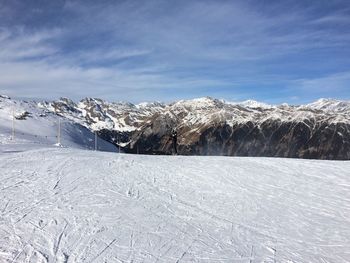 Scenic view of snow mountains against sky