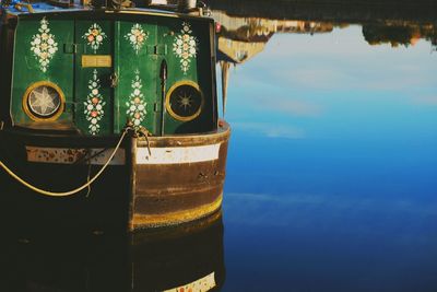 Close-up of metal ship against sea