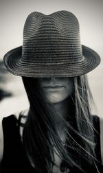 Close-up of woman wearing hat