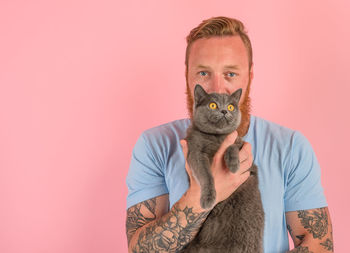 Portrait of a cat against white background