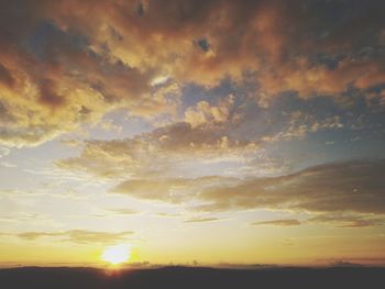 Low angle view of dramatic sky during sunset