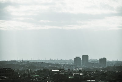 Modern buildings in city against sky